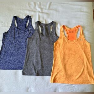 Under Armour tank tops, size small, purple, gray and orange.